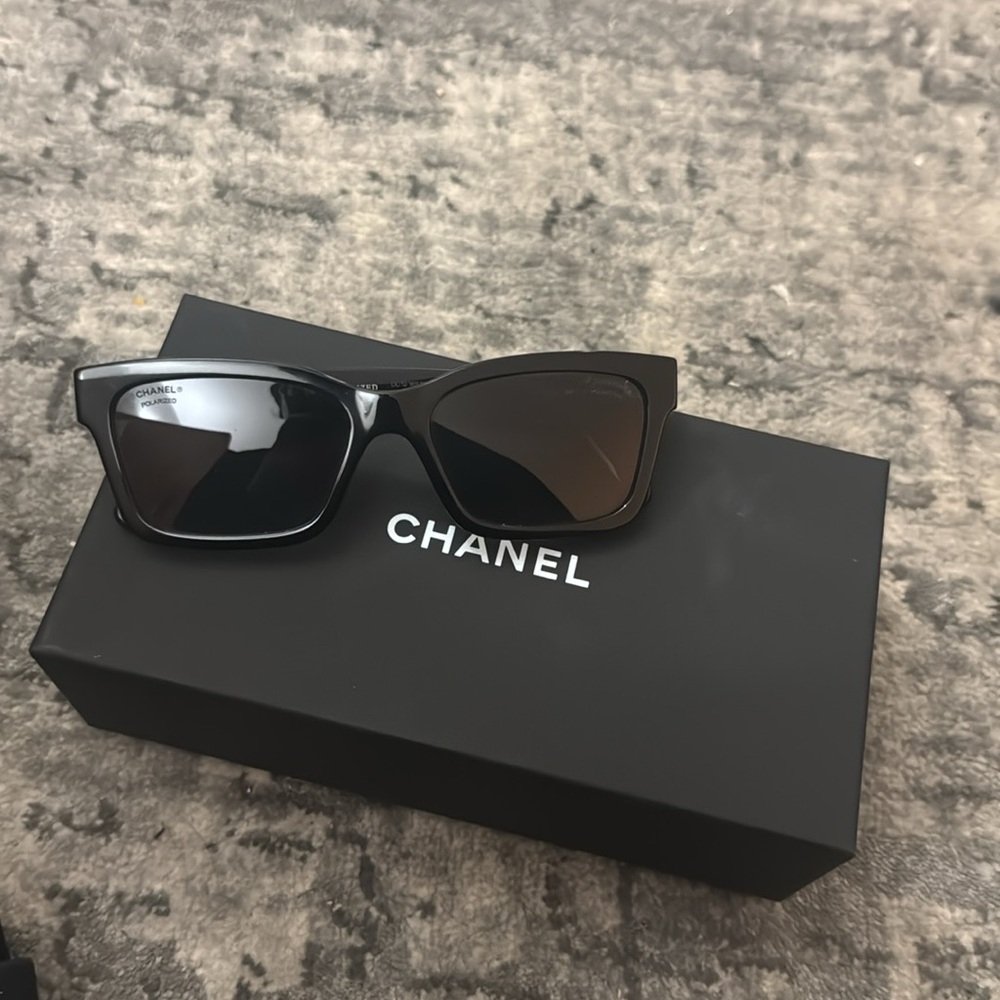 Black Chanel sunglasses in great condition. Chanel detail Sold with case +wipe.
